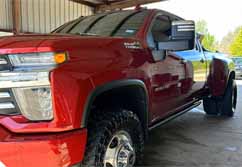 Mobile Vehicle Washing Red Chevy Silverado Truck by High Performance Pressure Washing based in Athens, TX.